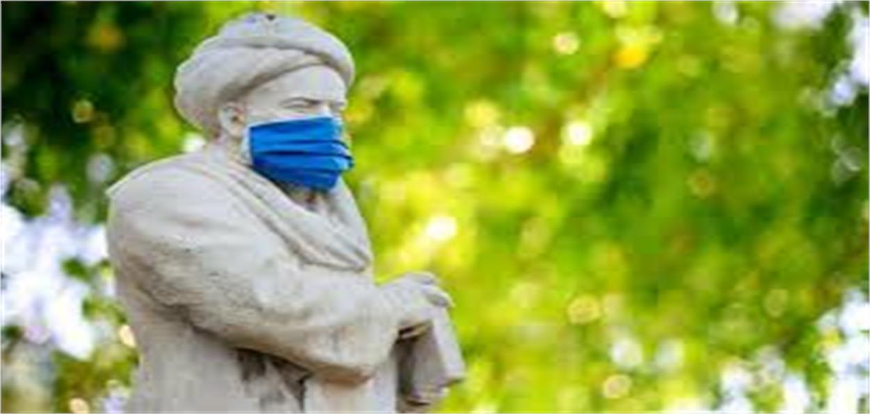 Statue of Ibn Sina (Avicenna) in Hamadan wearing a mask